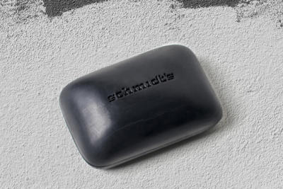 Schmidt's Cedarwood & Juniper soap on concrete background